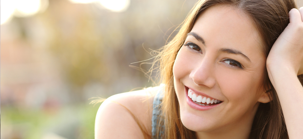 young adult woman smiling showing beautiful teeth created with Marco Island cosmetic dentistry